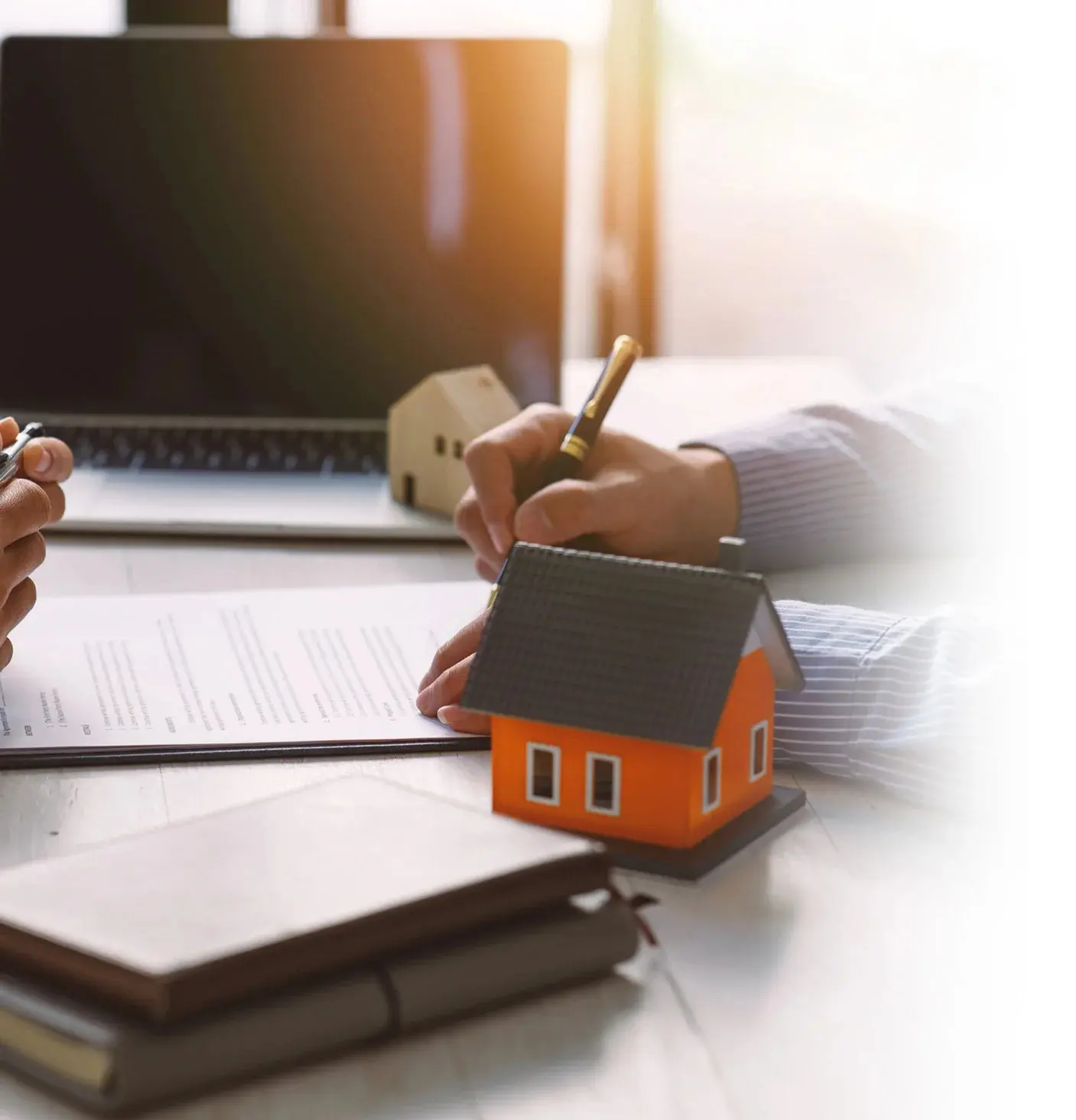 Person signing real estate contract.